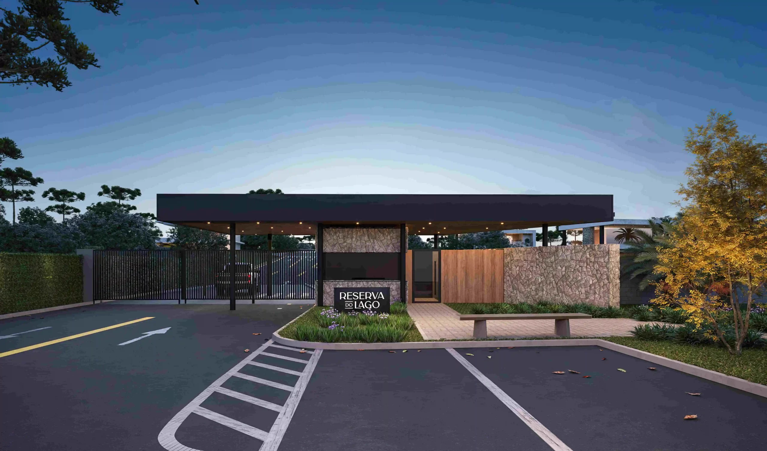 Entrada moderna do condomínio fechado em Curitibanos, Reserva do Lago, com estrutura em pedra e madeira, paisagismo elegante e portaria coberta.