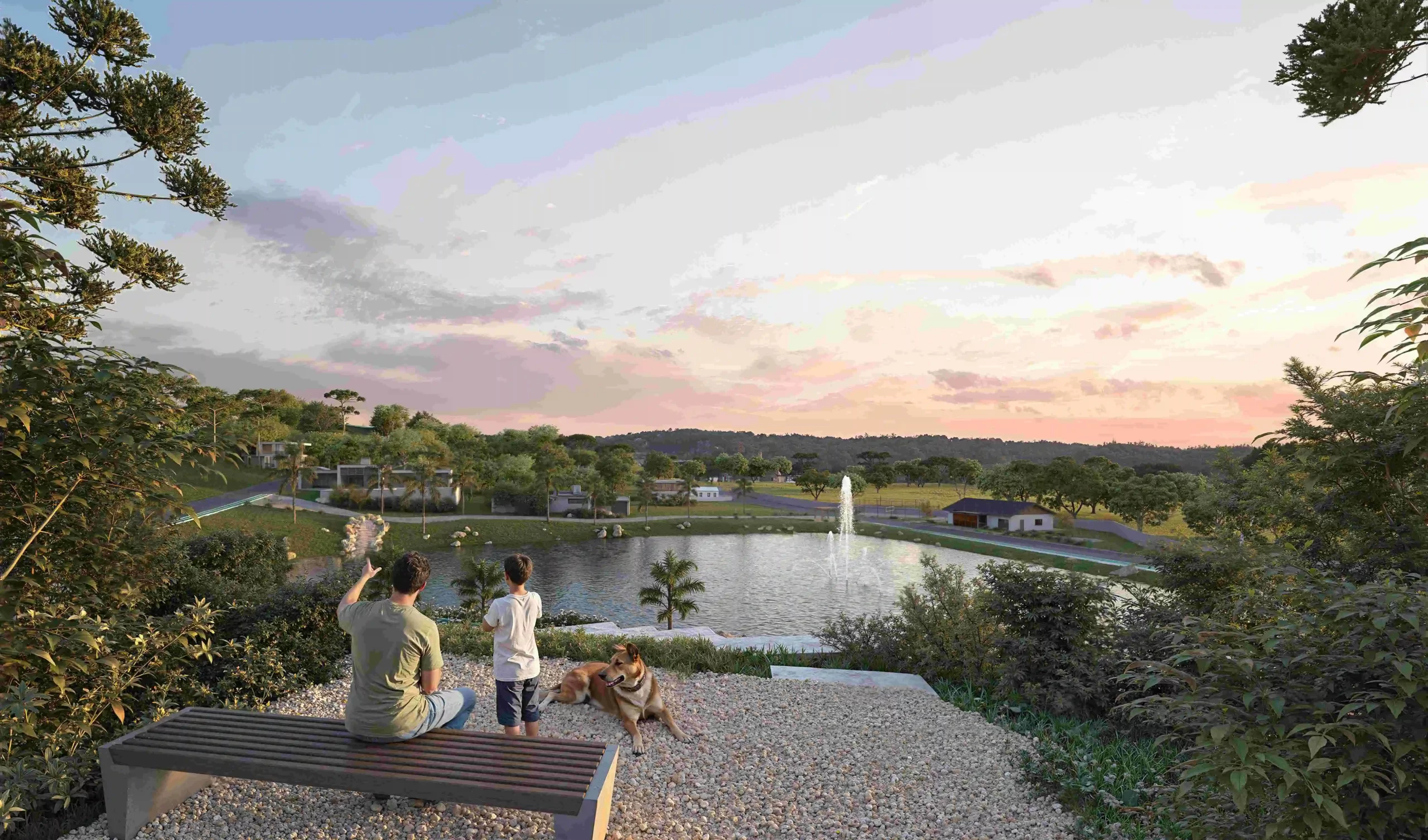 Família sentada em banco ao pôr do sol em frente a lago com fonte, cercado por natureza e casas, representando a tranquilidade de um condomínio fechado em Curitibanos.