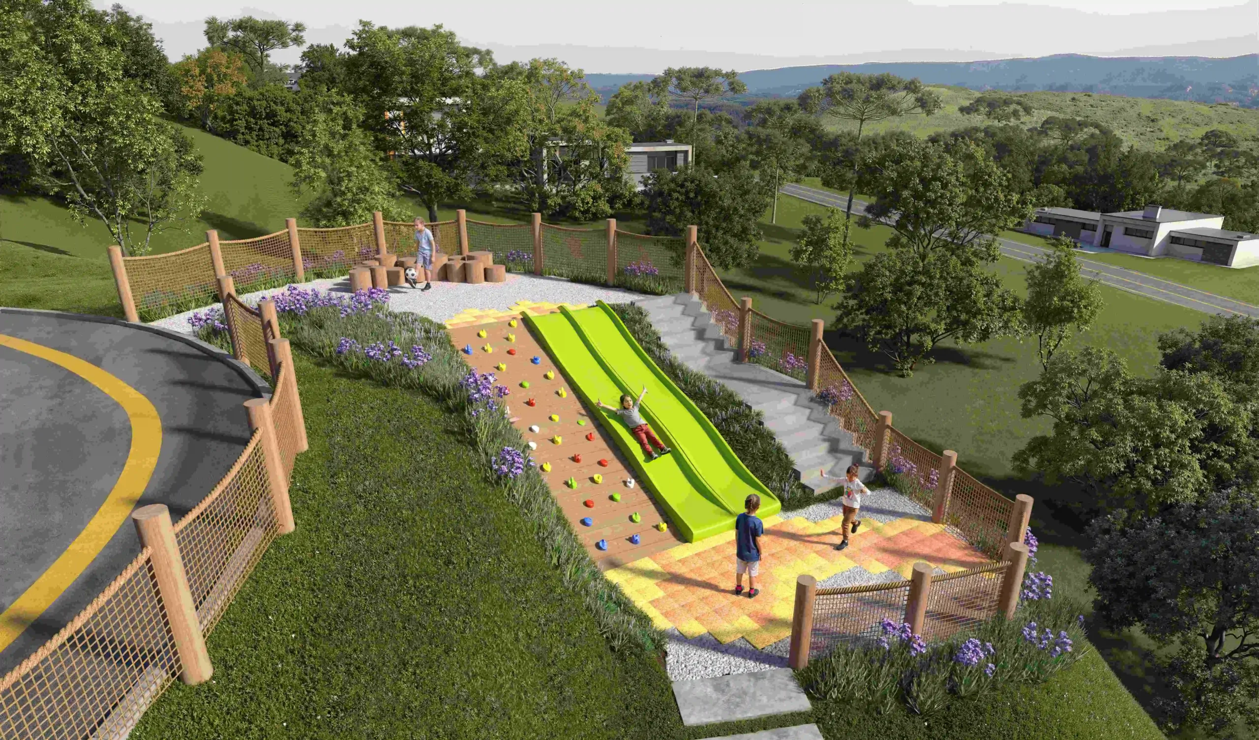 Crianças brincando em playground integrado à natureza, com escorregadores e troncos de madeira em área verde cercada por árvores e montanhas ao fundo.